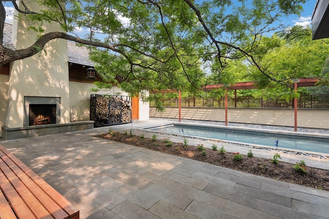 20545 Linden Rd, Deephaven, MN 55331 - outdoor pool featuring a tiled fireplace and a patio