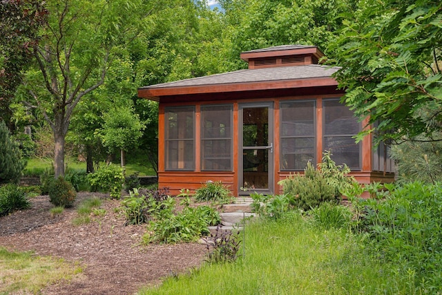 20545 Linden Rd, Deephaven, MN 55331 - view of outdoor structure with a sunroom