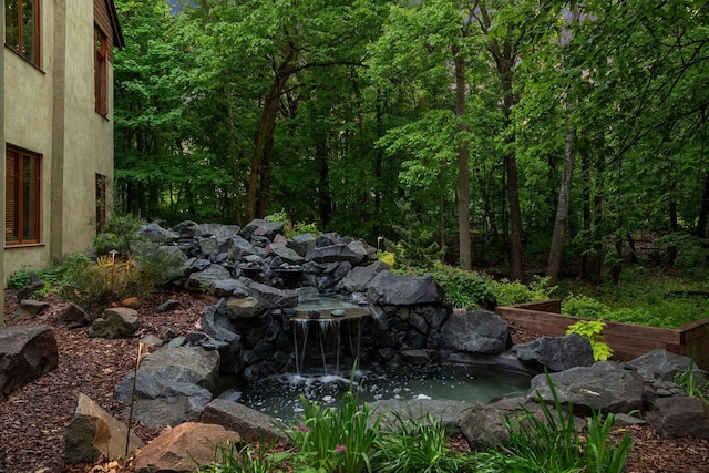 20545 Linden Rd, Deephaven, MN 55331 - view of yard featuring a small pond and a forest view