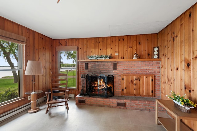 10001 Jeske Ave NW, Corinna Twp, MN 55302 - living room featuring healthy amount of natural light, wood walls, tile patterned floors, a fireplace, and a water view