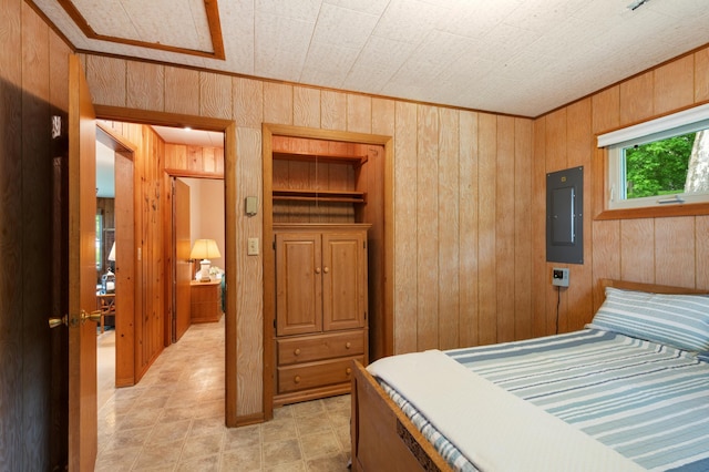 10001 Jeske Ave NW, Corinna Twp, MN 55302 - bedroom featuring electric panel, wood walls, and ornamental molding