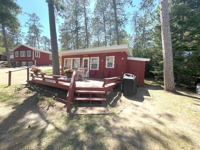25186 US-71 # 18, Park Rapids, MN 56470 - rear view of property featuring a wooden deck