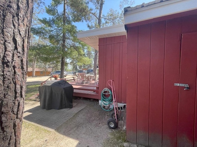 25186 US-71 # 18, Park Rapids, MN 56470 - view of side of home featuring a deck and board and batten siding