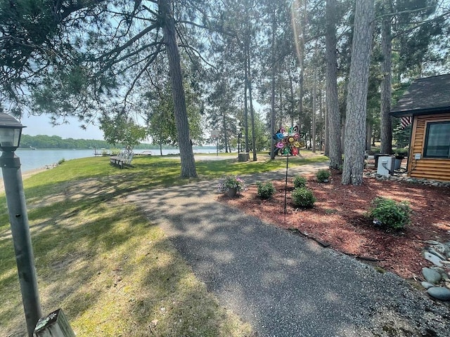25186 US-71 # 18, Park Rapids, MN 56470 - view of green lawn with a water view and a playground