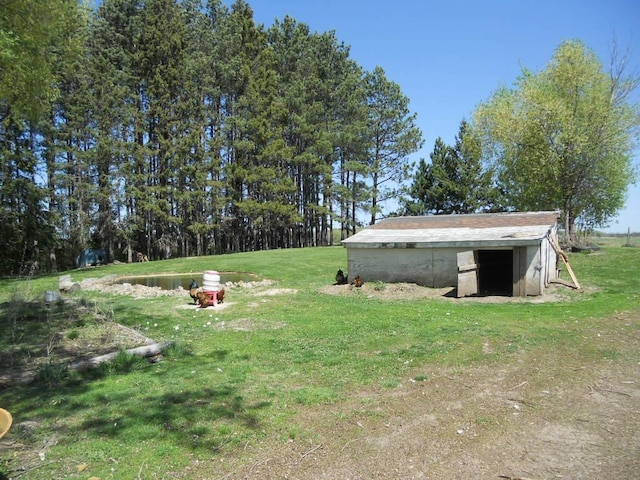 39769 Kestrel Ave, Tamarack, MN 55787 - view of green lawn featuring an outdoor structure