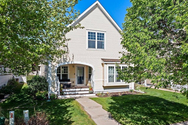 2737 Faulkner Dr, Chaska, MN 55318 - view of front of home featuring a front yard and a porch