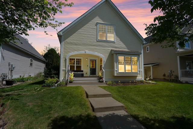 2737 Faulkner Dr, Chaska, MN 55318 - traditional-style home with covered porch and a front yard
