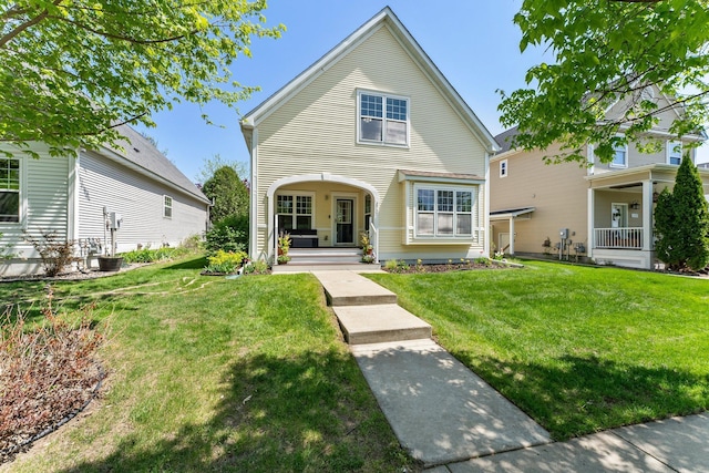 2737 Faulkner Dr, Chaska, MN 55318 - traditional-style house featuring covered porch and a front lawn