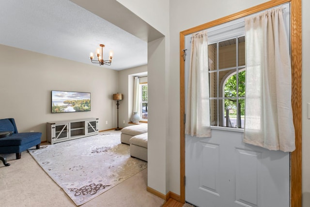 2737 Faulkner Dr, Chaska, MN 55318 - living room with a chandelier, carpet flooring, and baseboards