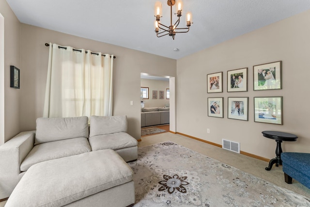 2737 Faulkner Dr, Chaska, MN 55318 - carpeted living room with a chandelier and baseboards