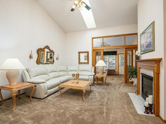 9349 Kimberly Ln N, Maple Grove, MN 55311 - carpeted living room featuring ceiling fan, a tiled fireplace, a skylight, and high vaulted ceiling