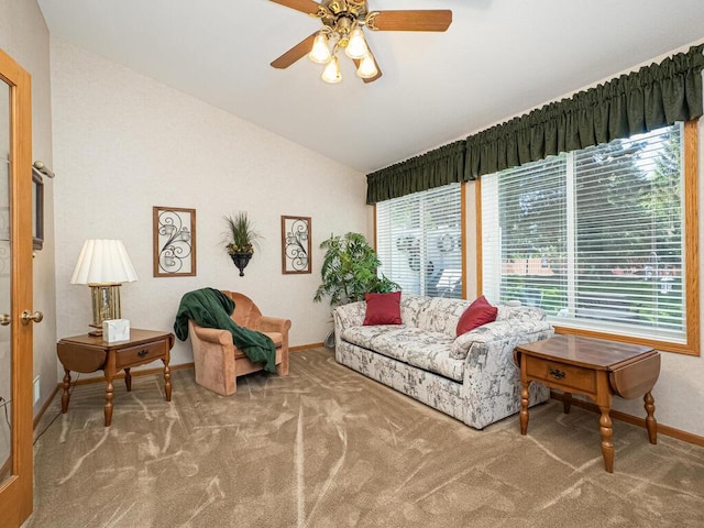 9349 Kimberly Ln N, Maple Grove, MN 55311 - carpeted living area with lofted ceiling, baseboards, and ceiling fan