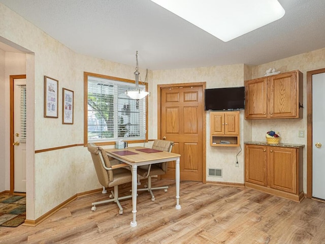 9349 Kimberly Ln N, Maple Grove, MN 55311 - dining room featuring light wood-style floors, wallpapered walls, and baseboards