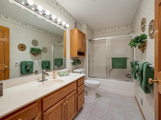 9349 Kimberly Ln N, Maple Grove, MN 55311 - bathroom featuring wallpapered walls, vanity, toilet, enclosed tub / shower combo, and tile patterned floors