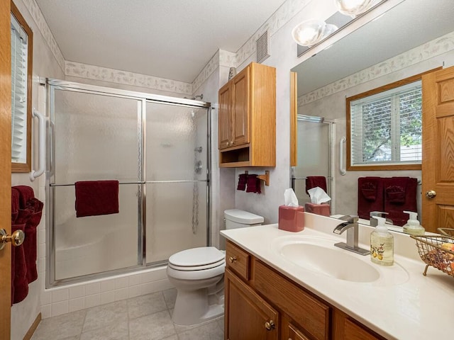 9349 Kimberly Ln N, Maple Grove, MN 55311 - bathroom with toilet, vanity, a shower stall, and tile patterned flooring
