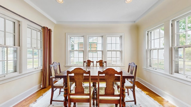 dining room featuring light wood-type flooring, baseboards, and recessed lighting
