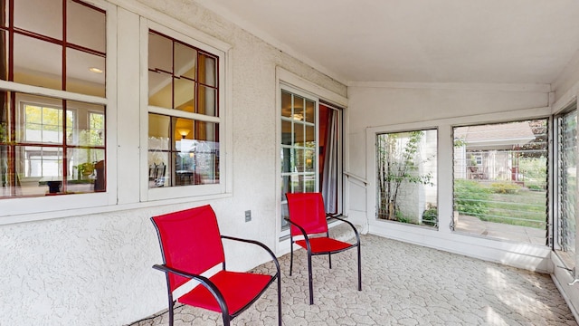 sunroom with lofted ceiling