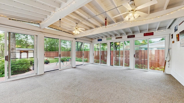 unfurnished sunroom featuring a ceiling fan and lofted ceiling