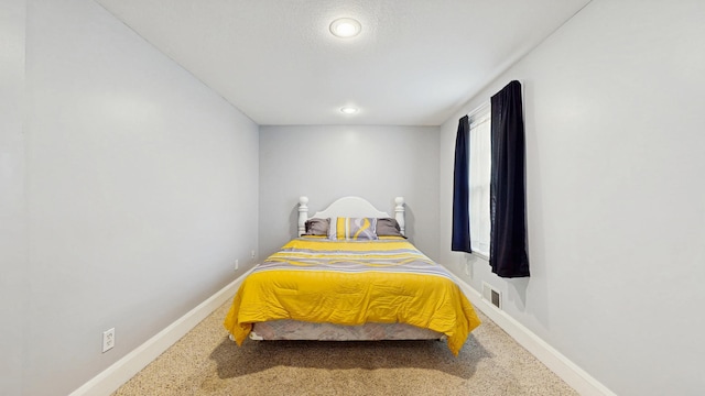 bedroom with carpet and baseboards