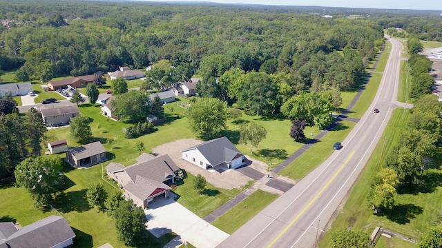 1212 7th St S, Waite Park, MN 56387 - aerial perspective of suburban area with a heavily wooded area