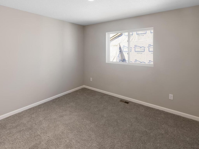 7463 147th Ln NW, Ramsey, MN 55303 - carpeted spare room featuring baseboards