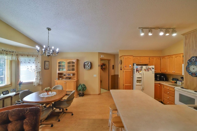 2506 Woodridge Ln, Brainerd, MN 56401 - kitchen with white appliances, a chandelier, light wood-type flooring, a textured ceiling, and light countertops