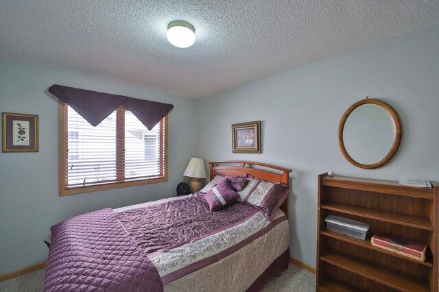 2506 Woodridge Ln, Brainerd, MN 56401 - carpeted bedroom with a textured ceiling and baseboards
