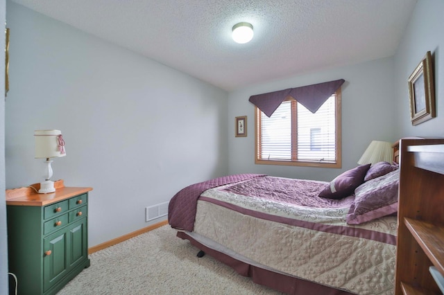 2506 Woodridge Ln, Brainerd, MN 56401 - carpeted bedroom with a textured ceiling and baseboards