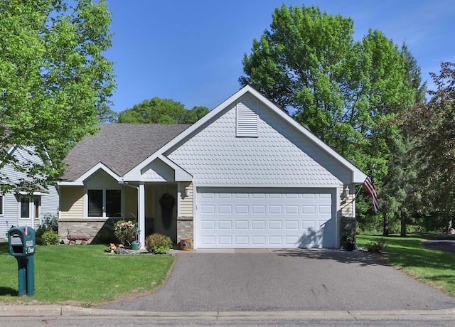 2506 Woodridge Ln, Brainerd, MN 56401 - view of front of property featuring driveway, a front yard, an attached garage, a shingled roof, and brick siding