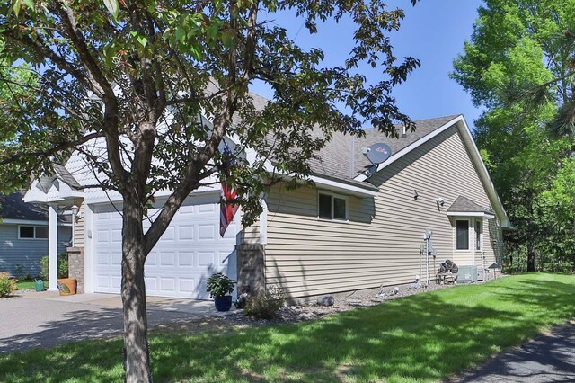 2506 Woodridge Ln, Brainerd, MN 56401 - view of side of property featuring concrete driveway and a yard