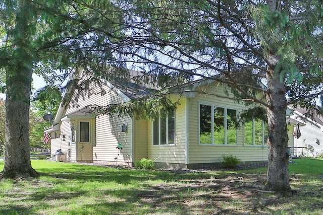 2506 Woodridge Ln, Brainerd, MN 56401 - back of house featuring a lawn