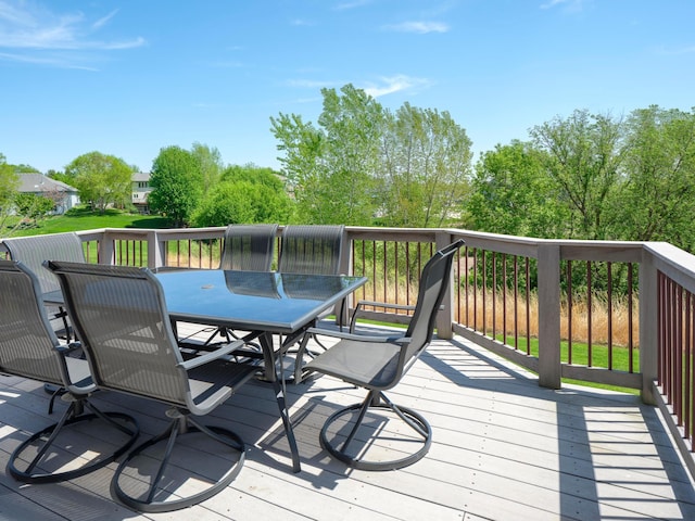 wooden deck with outdoor dining area