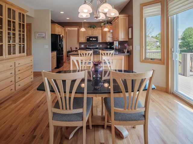 dining room with light wood-style floors, baseboards, a chandelier, and recessed lighting