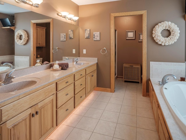 full bathroom with tile patterned flooring, a garden tub, radiator heating unit, double vanity, and a stall shower