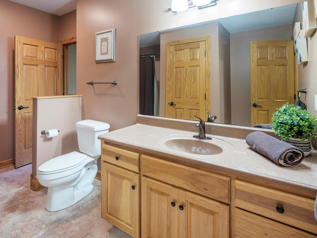 full bathroom featuring toilet and vanity