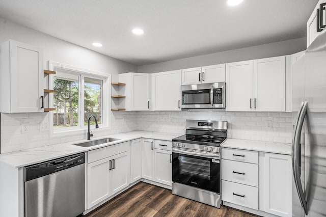 3213 63rd Ave N, Brooklyn Center, MN 55429 - kitchen with appliances with stainless steel finishes, a sink, open shelves, recessed lighting, and white cabinets