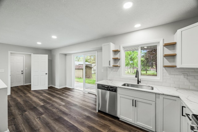 3213 63rd Ave N, Brooklyn Center, MN 55429 - kitchen featuring stainless steel dishwasher, a sink, open shelves, tasteful backsplash, and recessed lighting