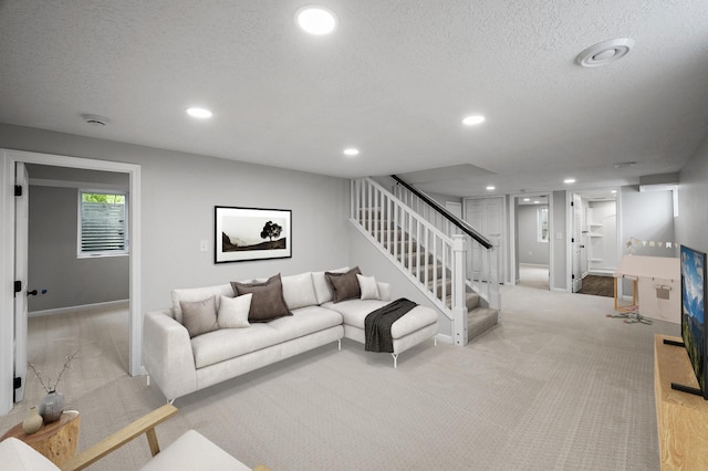 3213 63rd Ave N, Brooklyn Center, MN 55429 - living area with carpet, recessed lighting, stairs, a textured ceiling, and baseboards