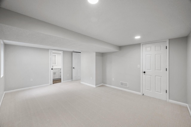 3213 63rd Ave N, Brooklyn Center, MN 55429 - finished basement featuring baseboards, light carpet, and recessed lighting