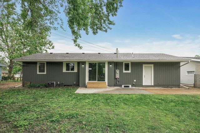3213 63rd Ave N, Brooklyn Center, MN 55429 - back of property featuring a patio, a lawn, entry steps, and central AC unit