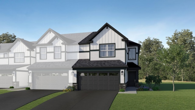 view of front of house with board and batten siding, a garage, concrete driveway, a front yard, and roof with shingles