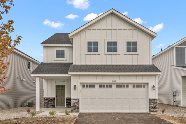14617 Quintana St NW, Ramsey, MN 55303 - view of front facade featuring a shingled roof, board and batten siding, and driveway