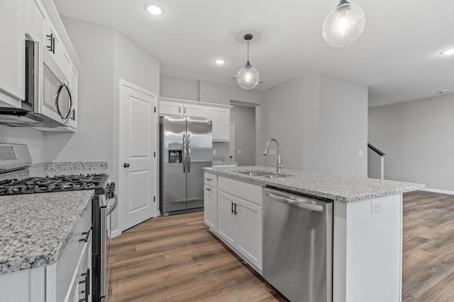 14617 Quintana St NW, Ramsey, MN 55303 - kitchen featuring stainless steel appliances, a sink, an island with sink, recessed lighting, and wood finished floors