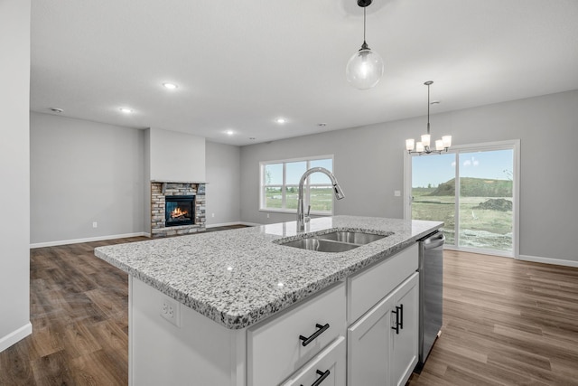 14617 Quintana St NW, Ramsey, MN 55303 - kitchen featuring a sink, dark wood-style flooring, dishwasher, baseboards, and hanging light fixtures