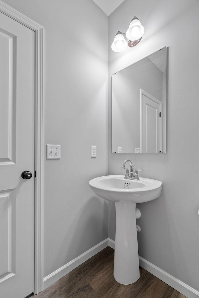 14617 Quintana St NW, Ramsey, MN 55303 - bathroom with wood finished floors and baseboards