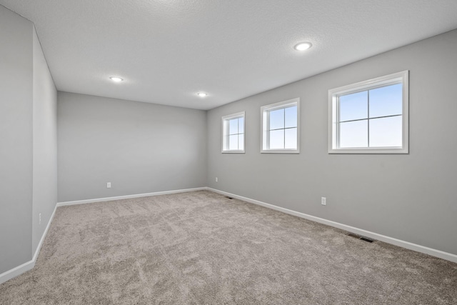 14617 Quintana St NW, Ramsey, MN 55303 - spare room featuring carpet, baseboards, and recessed lighting