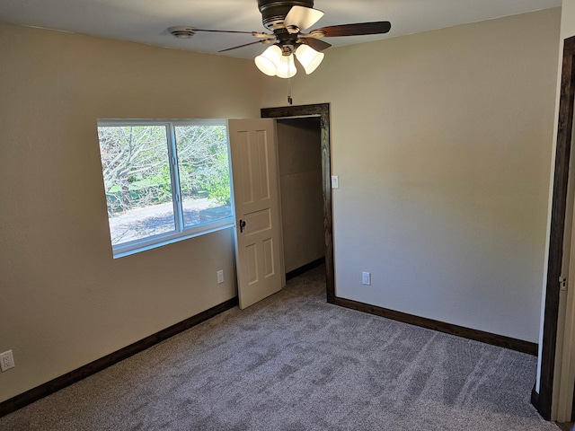 2729 King Ave, Slayton, MN 56172 - empty room featuring carpet, ceiling fan, and baseboards
