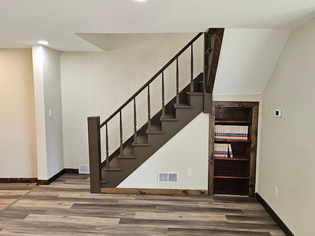 2729 King Ave, Slayton, MN 56172 - stairway with wood finished floors, baseboards, and recessed lighting