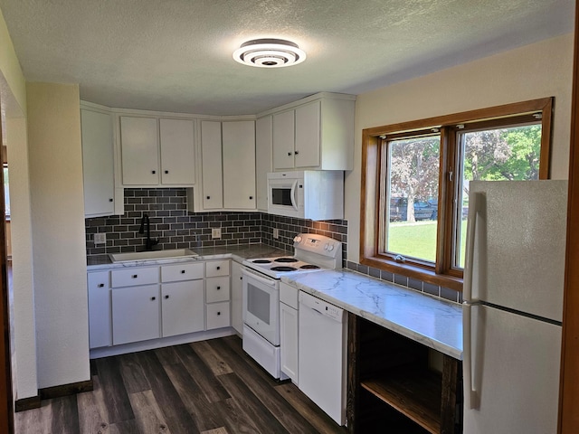 2729 King Ave, Slayton, MN 56172 - kitchen with white appliances, a sink, dark wood-style flooring, a textured ceiling, and light countertops