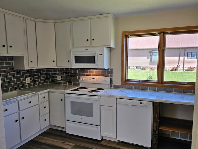 2729 King Ave, Slayton, MN 56172 - kitchen with white appliances, plenty of natural light, white cabinets, and dark wood-style flooring